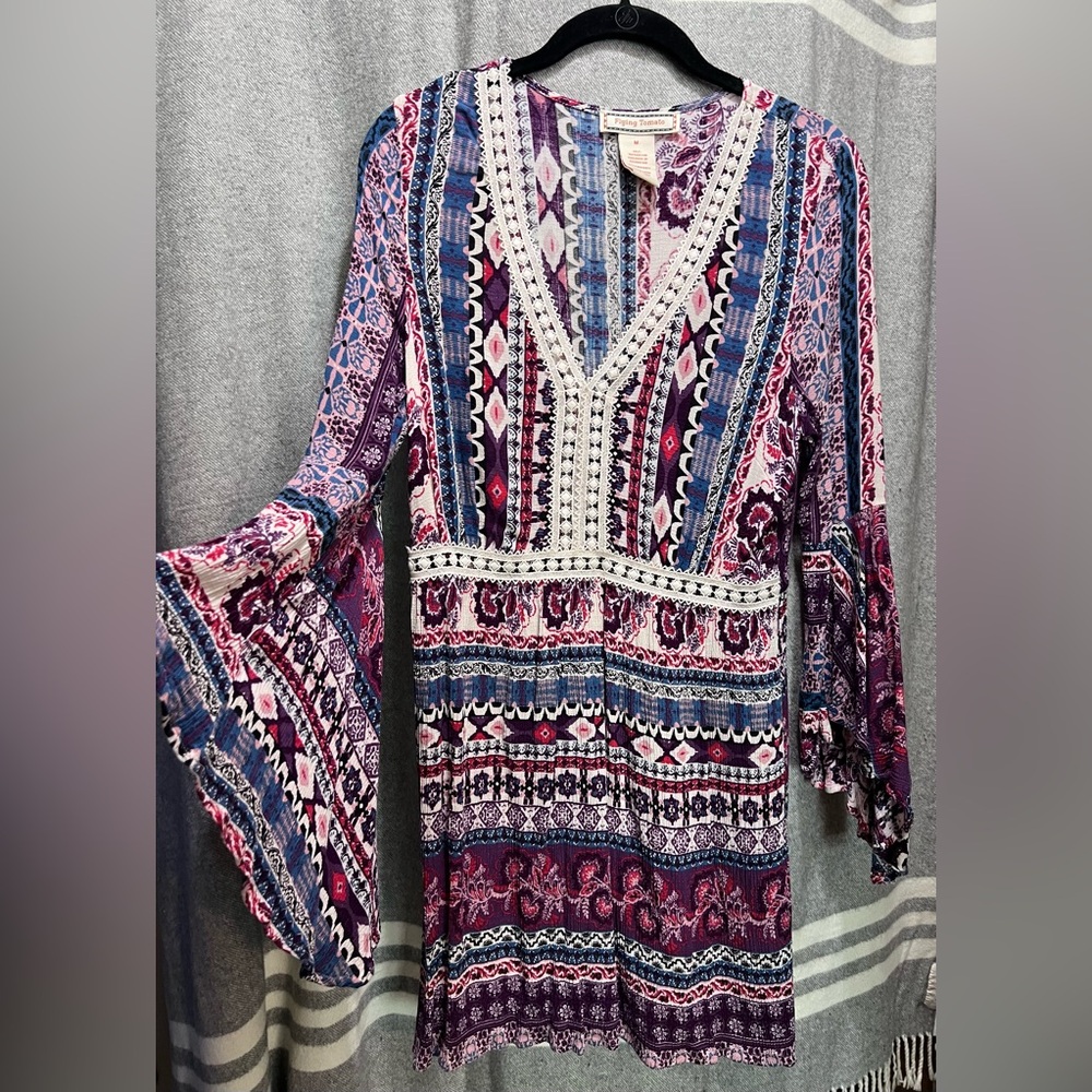 Flowing long sleeved dress.